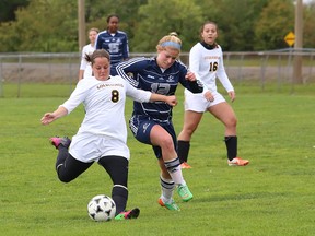 Katie Turner, right, of George Brown College, attempts to stop Megan Smykalski, of Cambrian College, during an OCAA women's soccer game at Cambrian College in Sudbury on Saturday.