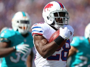 C.J. Spiller #28 of the Buffalo Bills runs for a touchdown against the Miami Dolphins during the second half at Ralph Wilson Stadium on September 14, 2014 in Orchard Park, New York.  (Vaughn Ridley/Getty Images/AFP)