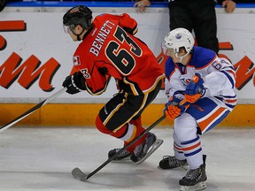 Calgary Flames prospect Sam Bennett of the Kingston Frontenacs takes the puck up the ice against Vladimir Tkachev of the Edmonton Oilers during the 2014 Young Stars Classic Tournament in Penticton, B.C., on Saturday. (Al Charest/QMI Agency)