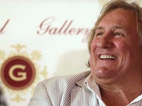 French actor Gerard Depardieu smiles during a news conference in Riga August 28, 2014. REUTERS/Ints Kalnins