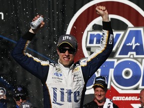 Brad Keselowski celebrates after winning the MyAFibStory.com 400 at Chicagoland Speedway on Sunday. (Getty Images/AFP)