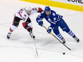 Toronto Maple Leafs forward Carter Verhaeghe keeps the puck away from Senators forward Matt Puempel during their 2014 NHL Prospects Tournament game at Budweiser Gardens in London on Sunday September 14, 2014.
CRAIG GLOVER The London Free Press / QMI AGENCY