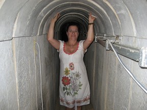 Denise Alexander stands in a Hamas tunnel, made with concrete meant for humanitarian aid. (SUE-ANN LEVY, Toronto Sun)