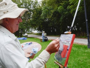Phil Chadwick, left, and Cyndy Nute approach the same view, but paint it from a different perspective on the last day of Paint the Town on Sunday. More than 45 artists gathered in historic Barriefield Village to paint and sketch as part of the Kingston School of Arts second annual Paint the Town, a weekend celebration in association with International Plein Air worldwide event. (Julia McKay/The Whig-Standard)