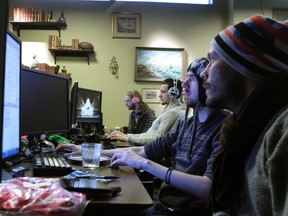 Coders work in the Mojang company office in Stockholm in this January 21, 2013 file photo. (INTS KALNINS/Reuters)