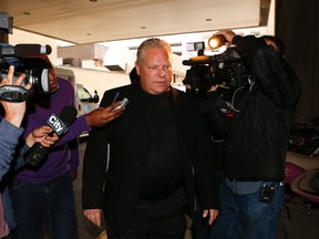 Toronto mayoral candidate Doug Ford arrives at Mount Sinai hospital on Sunday, Sept. 14, 2014, to visit the mayor. (JACK BOLAND/Toronto Sun)