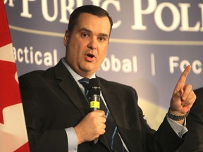Federal Industry Minister James Moore is pictured in Calgary, Alta., on April 7, 2014. (Darren Makowichuk/QMI Agency)