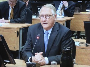 Former Montreal mayor Gerald Tremblay is seen on a television screen as he gives testimony at the Charbonneau commission in Montreal, April 25, 2013.  (REUTERS/Christinne Muschi)