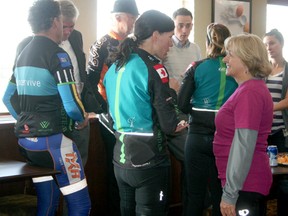 Cancervive riders talk to members of the DV100 organizing committee at a wine and cheese event held to welcome the out-of-town cyclists who stopped in Drayton Valley last week. Twenty-seven riders started a  four-day journey to raise funds and awareness for Wellspring, a support centre for cancer patients.