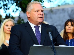 Councillor Doug Ford speaks to media at his mother's house with his family after entering the mayoral race in Toronto Friday September 12, 2014. (Dave Abel/Toronto Sun)