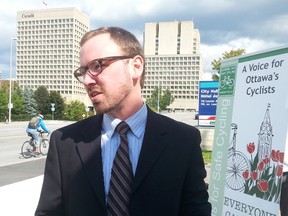 Michael Powell of Citizens for Safe Cycling was outside City Hall on Monday, Sept. 15, 2014 explaining why he thinks the city should be spending $20 million annually on bike infrastructure. 
JON WILLING/OTTAWA SUN/QMI AGENCY