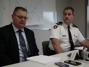 OPP Det. Insp. Chris Avery, left, and Huron OPP Commander Insp. Chris Martin read from prepared statements at press conference on Clinton shooting Sept. 15, 2014. John Miner/The London Free Press