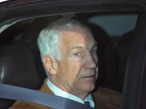 Former Penn State assistant football coach Jerry Sandusky leaves the Centre County Courthouse after his conviction in his child sex abuse trial in Bellefonte, Pennsylvania, June 22, 2012. (REUTERS/Pat Little/Files)