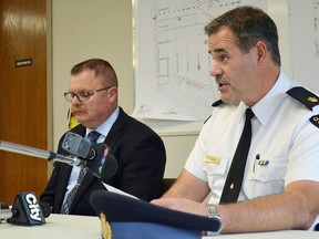 OPP Det. Insp. Chris Avery, left, and Huron OPP Commander Insp. Chris Martin read from prepared statements at press conference on Clinton shooting Sept. 15. (Whitney South, Huron Expositor)