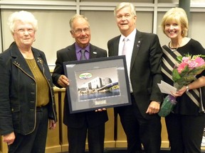 Sindey ward councillor Ron Hamilton, and wife Janet, received a warm send off from Mayor John Williams and wife Heather at Monday, Sept. 15, 2014's final Quinte West city council meeting of the term. The meeting was the end to Hamilton's 25-year career as a municipal politician. Williams presented framed prints of city hall to all 12 councillors while Heather Williams presented bouquets of flowers to spouses. - Ernst Kuglin/The Intelligencer/QMI Agency