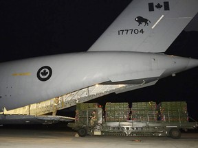 Pallets of military equipment are unloaded from a C-17 Globemaster operated by 429 Transport Squadron based at 8 Wing/CFB Trenton, on a Royal Airforce (UK) runway in the Mediterranean region during Operation IMPACT on Aug. 28, 2014. - M.Cpl. Patrick Blanchard, Canadian Forces Combat Camera