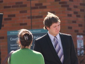 Matthew Spring, 21, stands outside of Barrie court talking to his mom Tuesday, Sept. 16, 2014. He charged with second-degree murder in the glow-in-the-dark mini putt death of Bradley Hubbard, 42, in 2011. (Tracy McLaughlin/Toronto Sun)