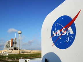 the NASA logo on a protective box for a camera near the space shuttle Endeavour at the Kennedy Space Center in Florida.  (AFP PHOTO/Stan HONDA)