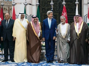 (From L-R): Egypt's Foreign Minister Sameh Shoukry, Kuwait's Foreign Minister Sabah Al-Khalid al-Sabah, Saudi Foreign Minister Prince Saud al-Faisal, U.S. Secretary of State John Kerry, Oman's Foreign Minister Yussef bin Alawi bin Abdullah, Bahrain's Foreign Minister Sheikh Khaled bin Ahmed al-Khalifa and Lebanon's Foreign Minister Gebran Bassil, stand together during a family photo with of the Gulf Cooperation Council and regional partners at King Abdulaziz International Airport's Royal Terminal in Jeddah September 11, 2014. (Reuters)
