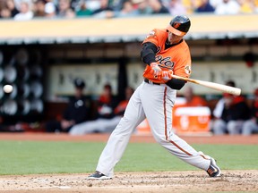 Baltimore Orioles first baseman Chris Davis hits a double to centre against the Oakland Athletics at O.co Coliseum on July 19, 2014. (Bob Stanton/USA TODAY Sports)