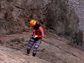 Natalie Spooner dangles from a cliff in New Brunswick (Screen grab)