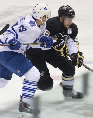 Toronto Maple Leafs' Cody Donaghey zeroes in on Pittsburgh Penguin Dominik Uher during the second period of their 2014 Rookie Tournament game on Sept. 16.