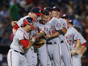 Members of the Washington Nationals celebrate after the division-clinching game against the Atlanta Braves at Turner Field on September 16, 2014. (Mike Zarrilli/Getty Images/AFP)