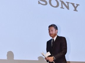 Sony Corp president and CEO Kazuo Hirai walks as he leaves a news conference at the company's headquarters in Tokyo September 17, 2014, in this photo taken and released by Kyodo. REUTERS/Kyodo