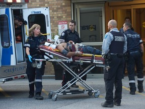 A victim arrives at Sunnybrook hospital after a double stabbing near Birchmount Rd. and Sheppard Ave. E. just before 6 p.m. Tuesday, Sept. 16, 2014. (Victor Biro photo)