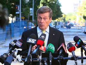Mayoral candidate John Tory speaks outside of his campaign office on Wellesley St. in Toronto on Tuesday, September 16, 2014. (Dave Abel/Toronto Sun)