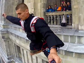 No Limit, an extreme sports team who BASE jump, snuck by the security and jumped off the Palace of Culture church in Poland’s capital, Warsaw.
(Screenshot from Barcroft TV's YouTube video)