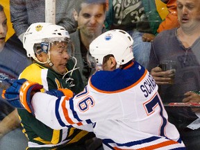 Edmonton Oilers rookie Chase Schaber hits Golden Bears Colin Joe during first period hockey action at Clare Drake Arena in Edmonton, Alta. on Tuesday, Sep. 10, 2013. The Golden Bears won 4-3. (EDMONTON SUN FILE)