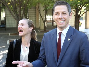 Winnipeg mayoral candidate Brian Bowman (r) and his wife Tracy laugh with reporters at city hall in Winnipeg, Man. Monday September 15, 2014 after filing nomination papers.