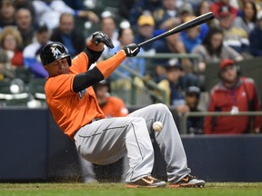 Marlins outfielder Giancarlo Stanton is hit by a pitch against the Brewers in Milwaukee on Sept. 11, 2014. (Benny Sieu/USA TODAY Sports)