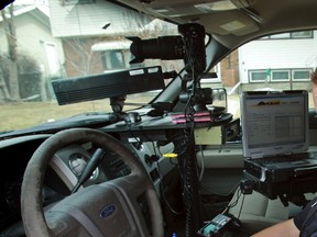 Peace Officer operates a photo radar unit on 75 st and 92 ave in Edmonton, Alberta on April 23,  2013.  Perry Mah/Edmonton Sun