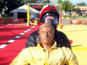 Quinte West firefighter David McCue drags a dummy during a FireFit competition in Ottawa on the weekend. McCue and teamates Greg King and Keith Locklin came home from the event sporting gold medals. The results gives the Quinte West team an automatic bye to the Canadian Championships to be held in Longueil Que. Sept. 10-14. 
Submitted photo.