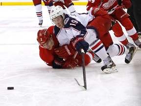 Brendan Smith of the Detroit Red Wings pulls down Ryan Johansen of the Columbus Blue Jackets on March 9, 2013 at Nationwide Arena.. (Kirk Irwin/Getty Images/AFP)