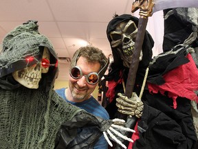 Jonathan Glass, co-owner of Party Stuff, displays some Halloween items in his store in Winnipeg Sept. 17, 2014.