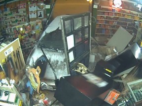 A stolen car smashes into Al Simmons Gun Store on Locke St. S. in Hamilton March 10, 2014. (YouTube framegrab)