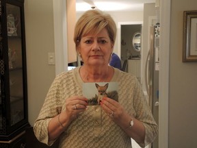 Francine Monette is pictured with a photo of her dog Mr. Albert. (MARIE-EVE DUMONT/QMI Agency)