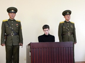 U.S. citizen Matthew Todd Miller sits in a witness box during his trial at the North Korean Supreme Court in this undated photo released by North Korea's Korean Central News Agency (KCNA) in Pyongyang September 14, 2014. (REUTERS/KCNA)