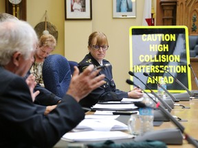 Chief of Belleville Police Cory McMullan listens as Bob Dolan, member of Belleville Police Service Board, shares his thoughts on the way traffic is flowing on Sidney Street, during a meeting at city hall in Belleville, Ont. Thursday, Sept. 18, 2014.  - JEROME LESSARD/THE INTELLIGENCER/QMI AGENCY