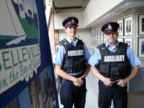Belleville Police's new auxiliary officers, out of five, Greg Kendall of Corbyville, left, and Anthony Justason of Trenton, have now completed their training and received their uniforms. The pair were introduced before the Belleville Police Service Board at city hall in Belleville, Ont. Thursday, Sept. 18, 2014. - JEROME LESSARD/THE INTELLIGENCER/QMI AGENCY