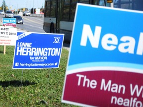 Election signs like the one pictured here on College Street East, can be found on street corners across the city. Public complaints about some of the signs location have prompt city officials to warn several candidates about the improper placement of signs. Jason Miller/The Intelligencer.