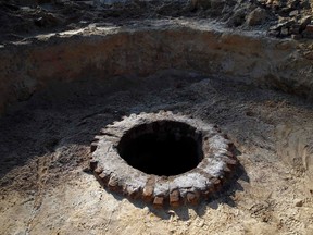 A recently uncovered well, used by the prisoners in Camp 1, is seen in the perimeter of a Nazi death camp in Sobibor September 18, 2014. (REUTERS/Kacper Pempel)