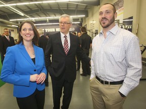 Health Minister Erin Selby and Premier Greg Selinger, seen here with Bomber running backs coach Buck Pierce, have become a little too comfortable and smug from the NDP being in power so long. (Chris Procaylo/Winnipeg Sun file photo)