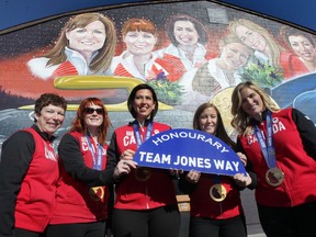 Janet Arnott (left to right), Dawn McEwen, Jill Officer, Kaitlyn Lawes and Jennifer Jones were on hand for the official unveiling of a mural in their honour at St. Vital Curling Club and the re-naming of a street nearby.