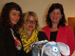 Stacey Wraight, left, Krista Schneider and Sherri Howard look over Memoria, Alzheimer Society St. Thomas-Elgin's entry in St. Thomas-Elgin Public Art Centre's Parade of Elephants. The society and the art gallery are partnering in an art therapy program for people living with dementia.
Eric Bunnell/Times-Journal