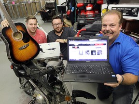 Rob McDonald (right) with his sons Cody (left) and Chris display some of the items that will be part of their online auction website. (Brian Donogh/Winnipeg Sun)