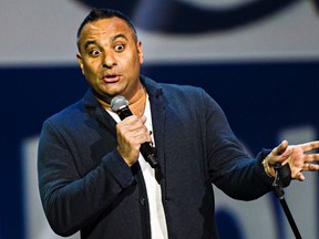 Comedian Russell Peters entertains the crowd at Rexall Place Thursday night. (Codie McLachlan/Edmonton Sun)